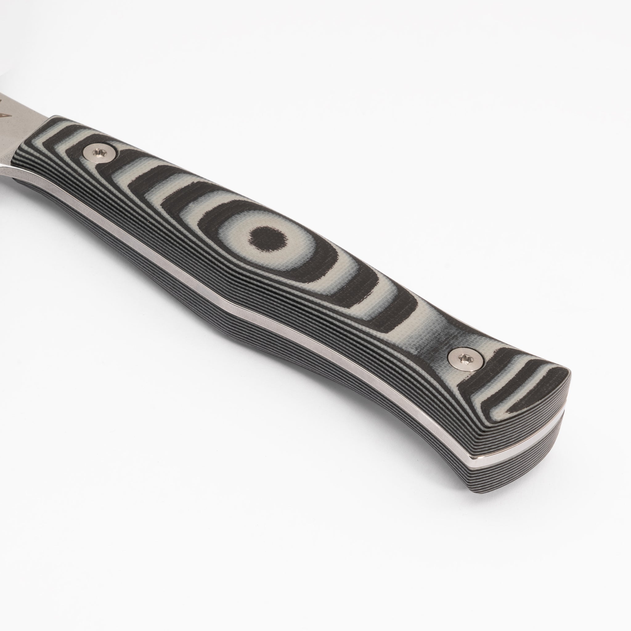 Detail closeup of kitchen knife with black and gray layered g-10 handle.