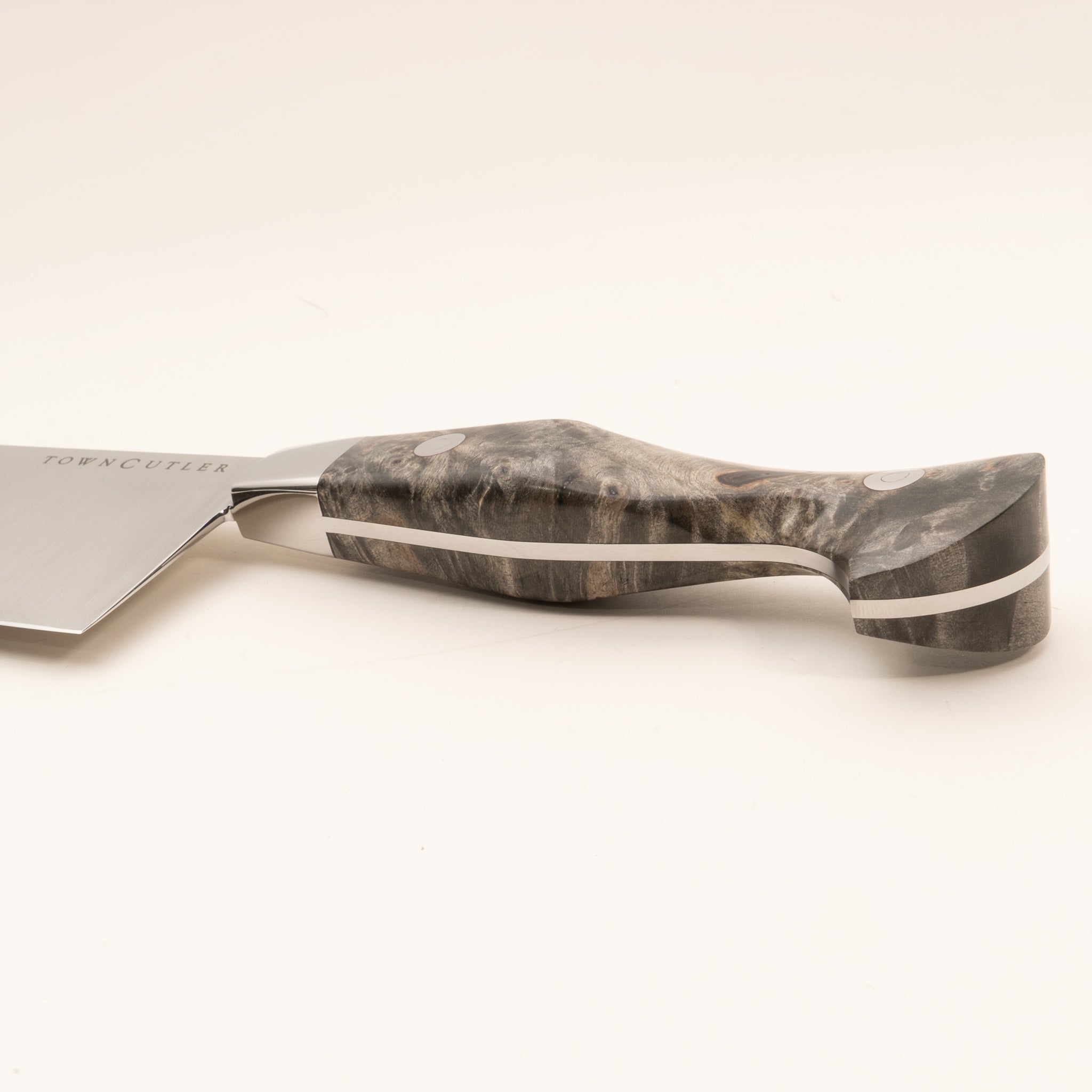 Detail photo of Classic 10" chef knife handle from Town Cutler with stainless steel blade and buckeye burl handle.