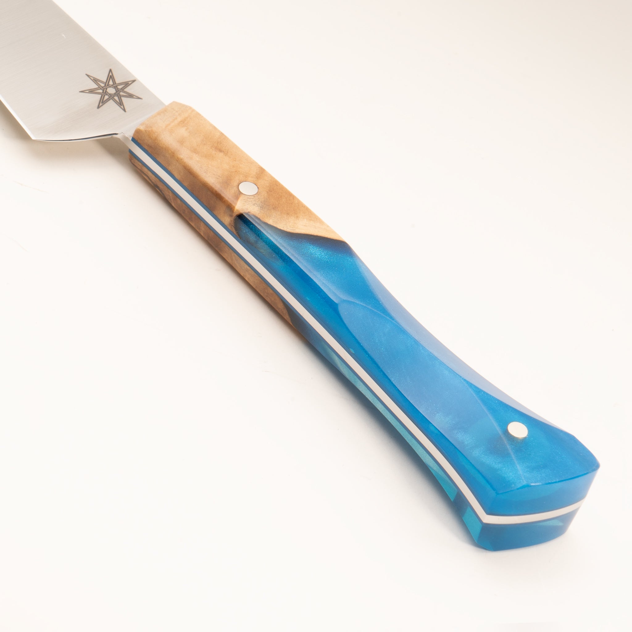 Detail photo of knife handle of Tahoe Bliss stainless steel paring knife with buckeye burl wood and blue resin handle by Town Cutler.