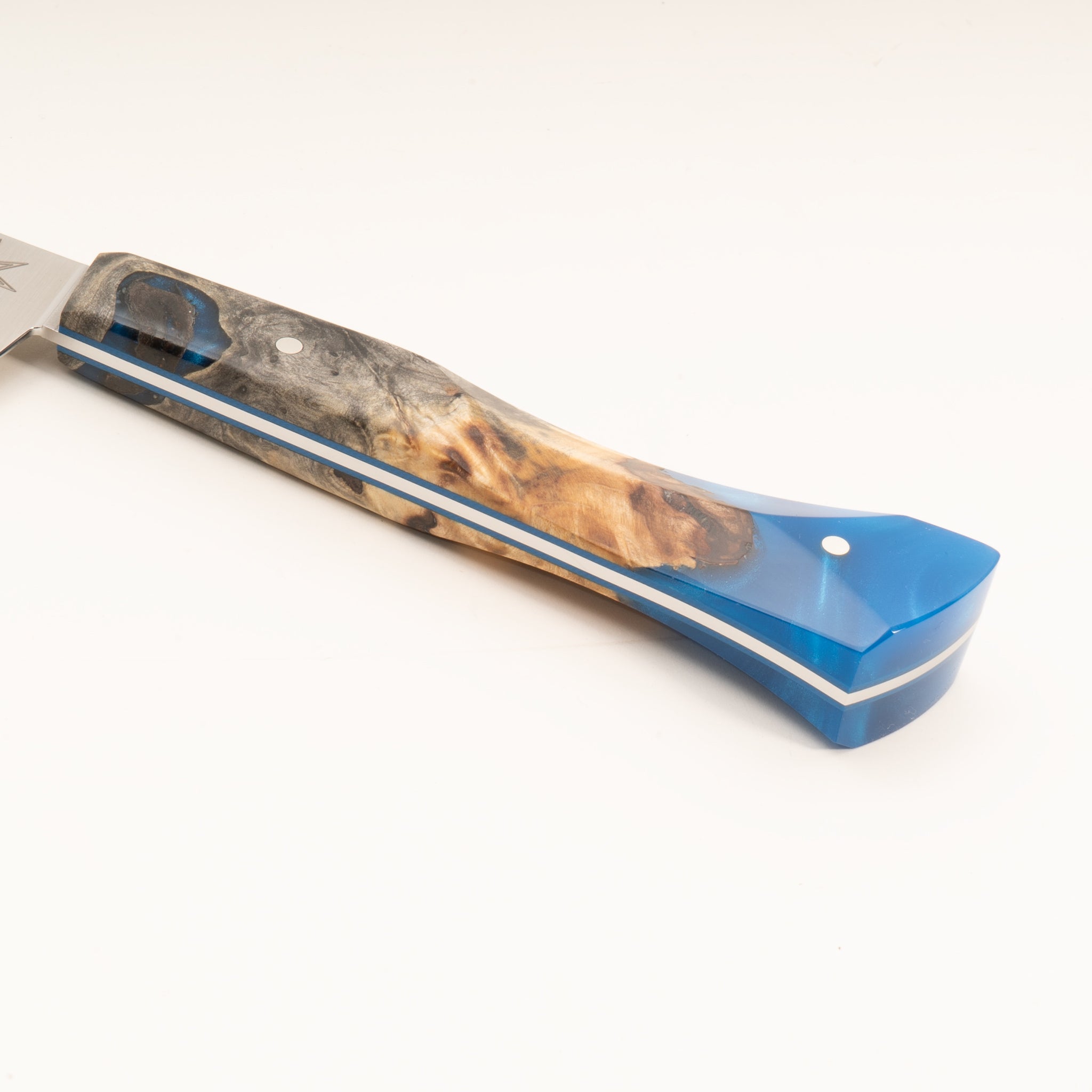 Detail photo of knife handle of Tahoe Bliss stainless steel kitchen utility knife with buckeye burl wood and blue resin handle by Town Cutler.