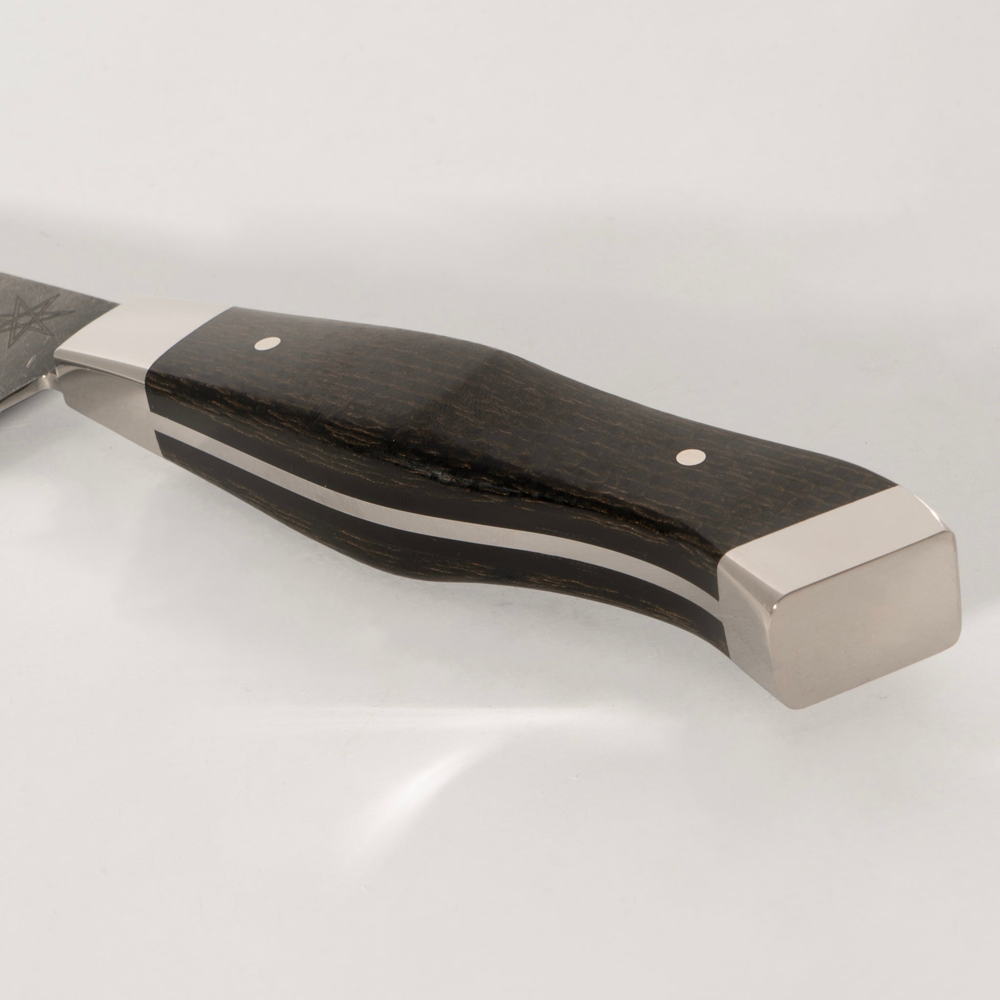 Detail photo of handle on 7" Carbon Steel Nakiri Knife with Stonewash Finish Blade, Black Burlap Micarta Handle, Stainless Steel Bolster and Pommel by Town Cutler