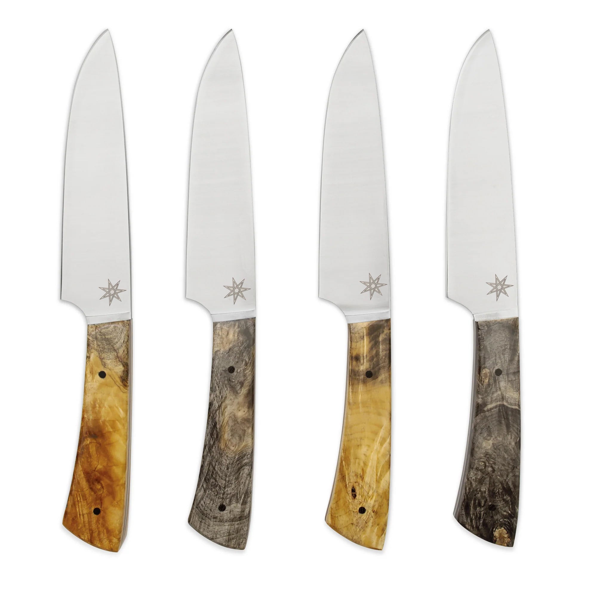 Set of four steak knives with wooden handles on a white background