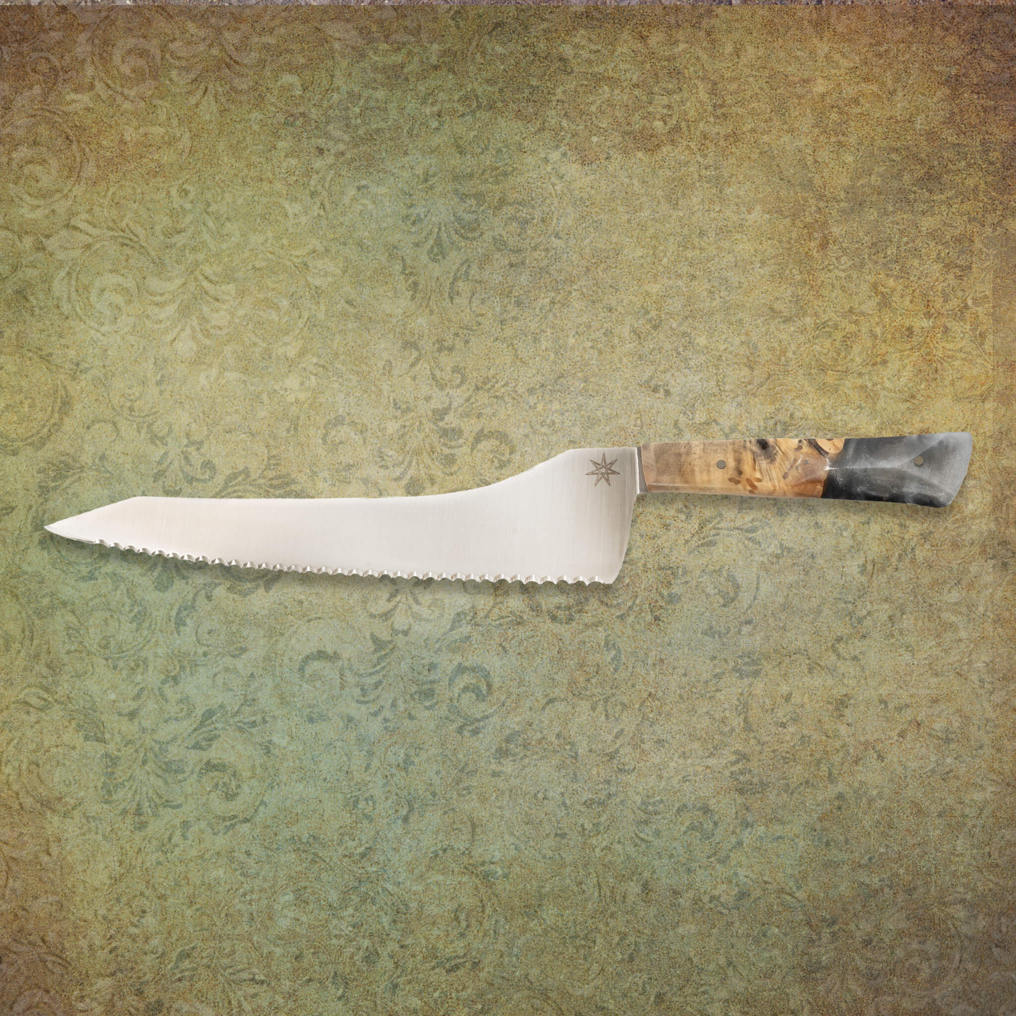 Offset serrated bread knife with silvery resin and buckeye wood handle knife.