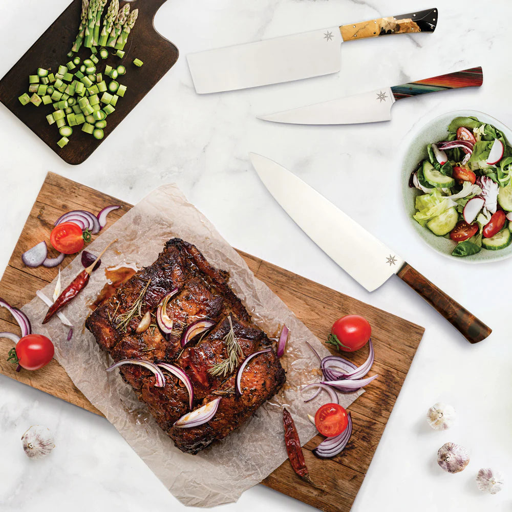 Town Cutler Kitchen Knives on marble background and cutting board with food.