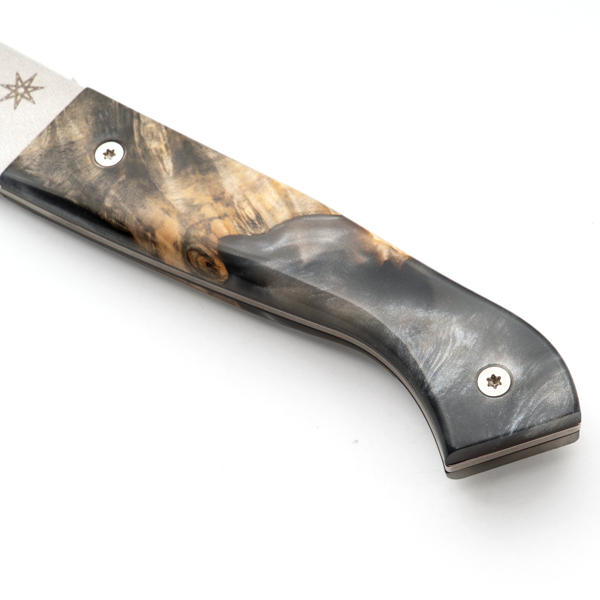 Detail of kitchen knife handle made from silver grey resin and wood.