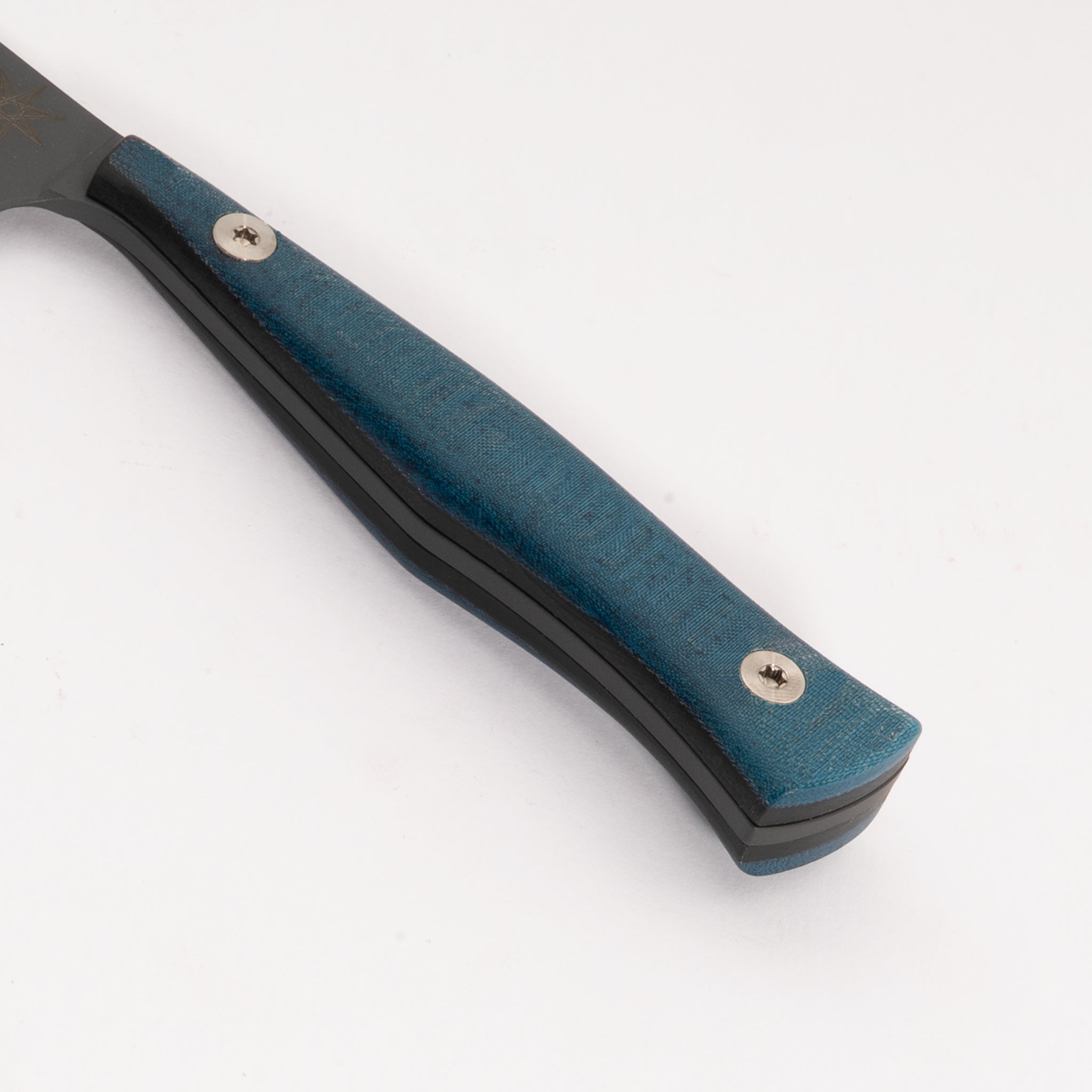 Close-up of a knife with a blue handle on a white background