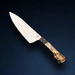 7" Chef knife by Town Cutler featuring the Desert Dawn handle made with live-edge Buckeye Burl and Nitro-V stainless steel blade.
