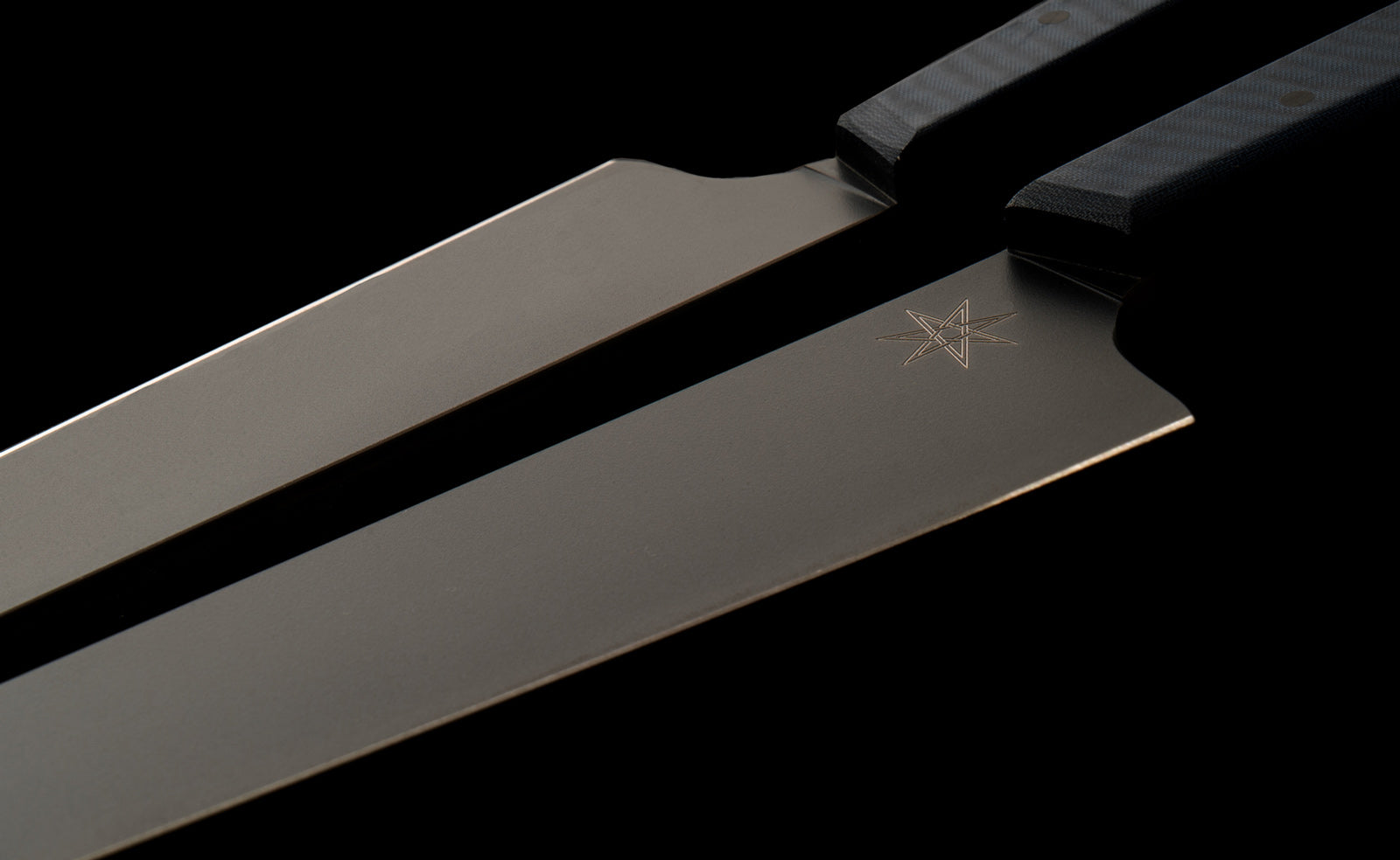 Close-up detail photo of two Town Cutler eXo Blue Slicer Carving Knives