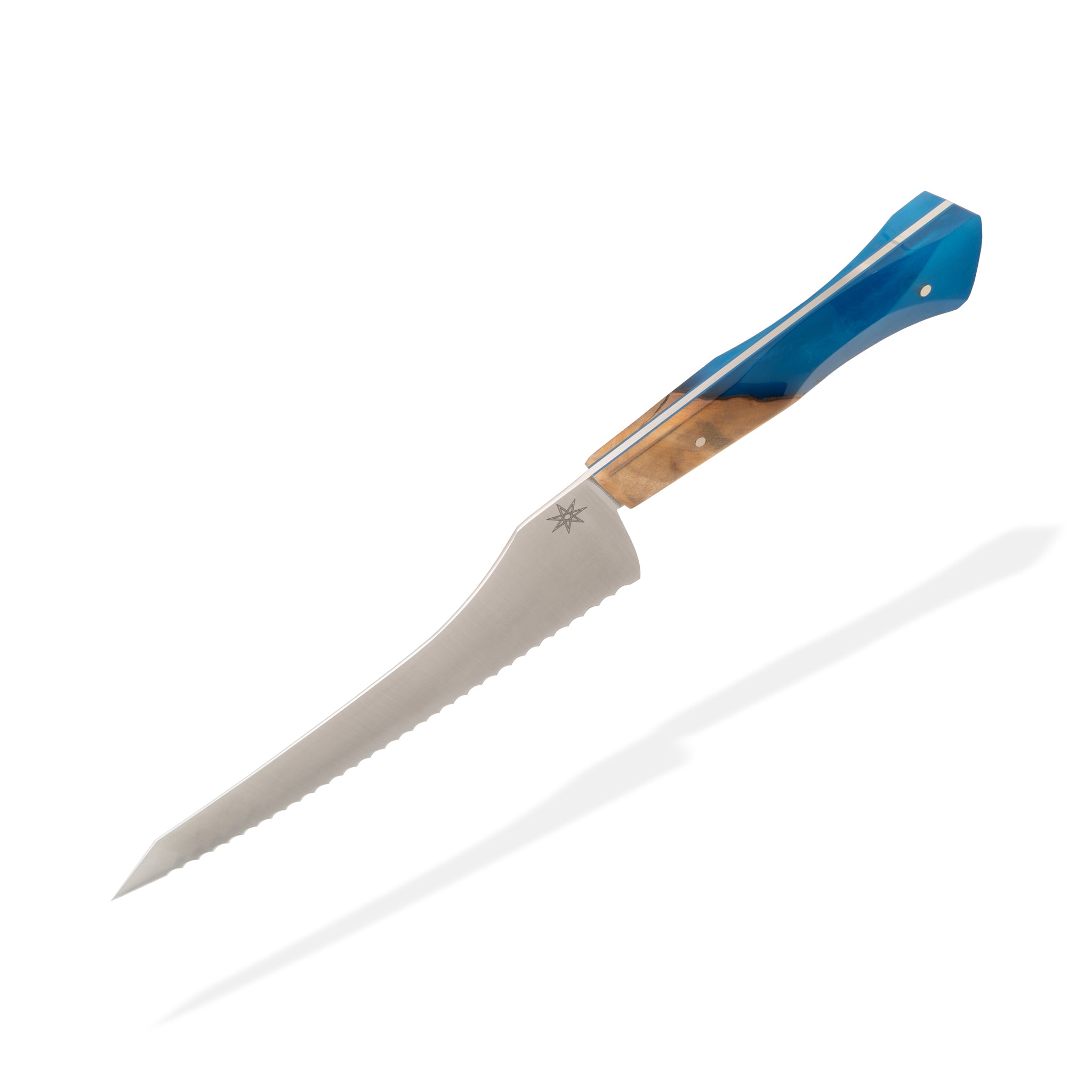 Detail photo of Tahoe Bliss stainless steel bread knife with buckeye burl wood and blue resin handle by Town Cutler.
