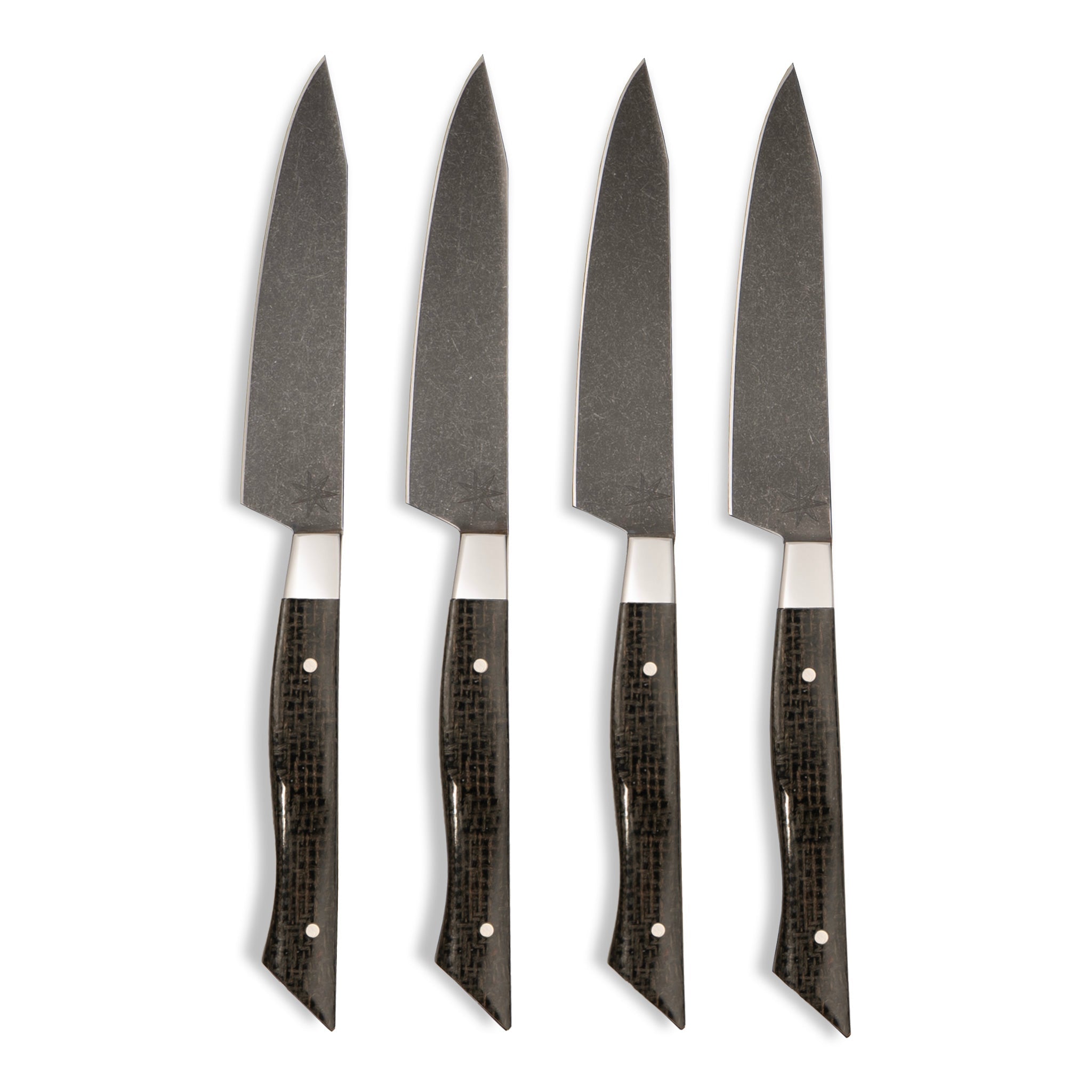 Town Cutler set of four Carbon Pommel steak knives with sleek black handles displayed on a white surface.