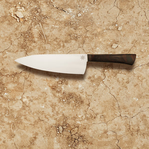 7" chef knife for those who prefer a slightly smaller chef knife. Made with stainless steel and desert ironwood. Kitchen knife with wood handle and branch design and star engraved on blade.