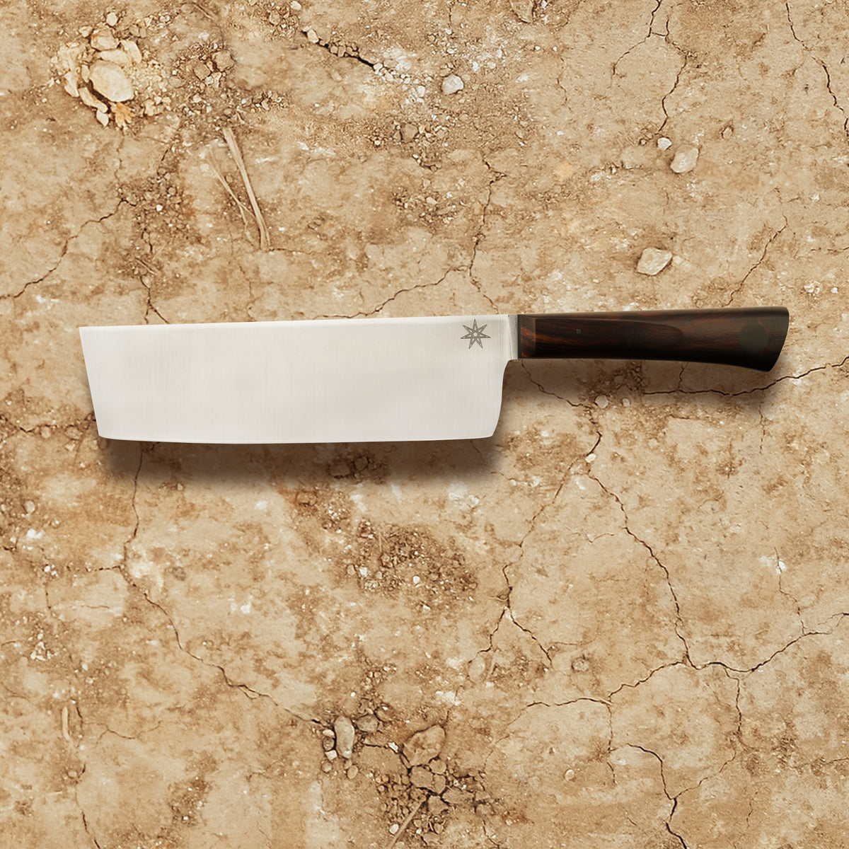 Our Olneya Nakiri knife is a lux kitchen knife made with a real wood handle. This vegetable knife has a tall, square blade, to help with thin, straight cuts. 