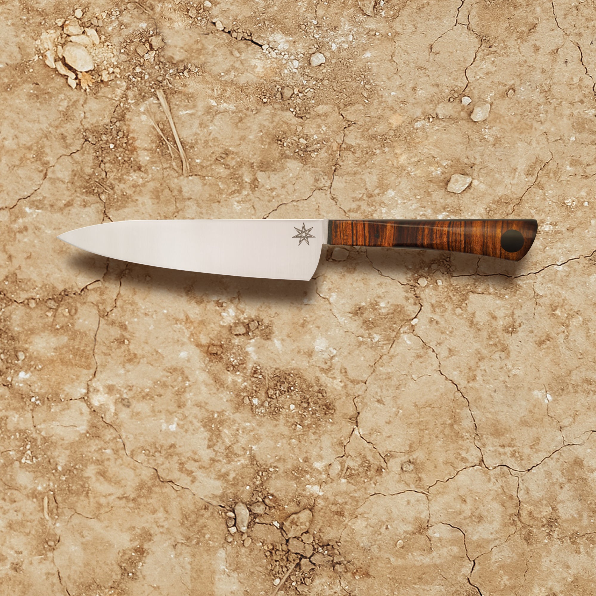 Kitchen knife with wood handle made from desert ironwood and stainless steel blades.