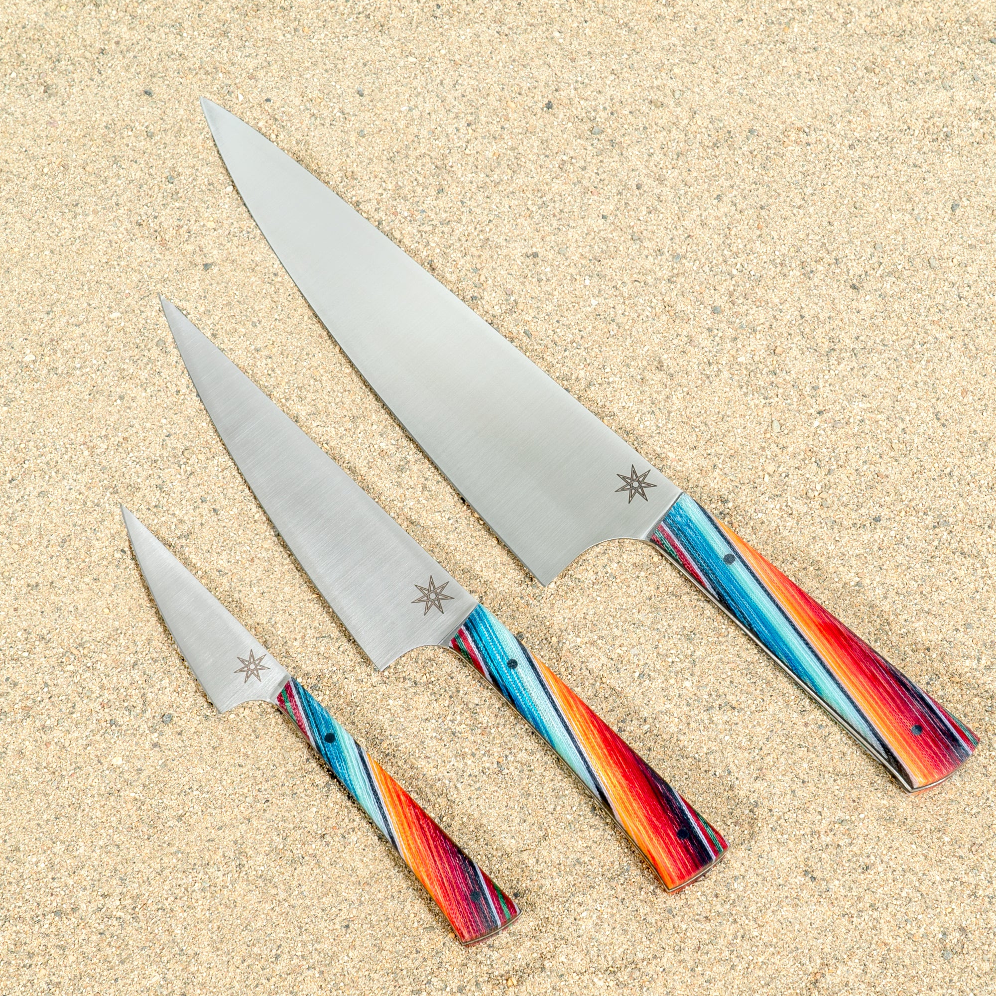 Baja Sous Chef Set from Town Cutler. Kitchen knife set with three knives. 8.5" Chef Knife, 6" Utility Knife, and 3" Paring knife with colorful Mexican blanket pattern handles.